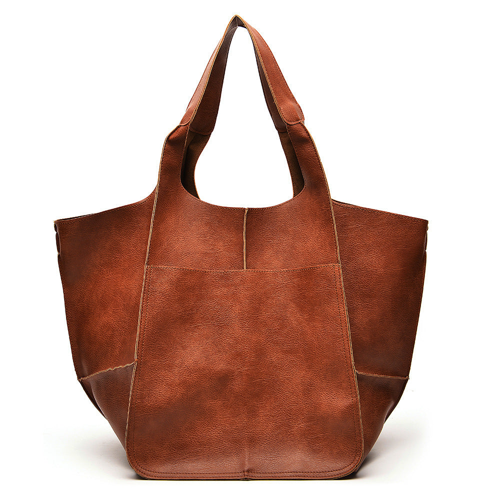 Sac à main en cuir souple, grand format, grande capacité, à porter à l'épaule ou à la main.