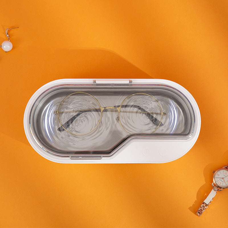 Petite machine de nettoyage pour lunettes, bijoux et cosmétiques.