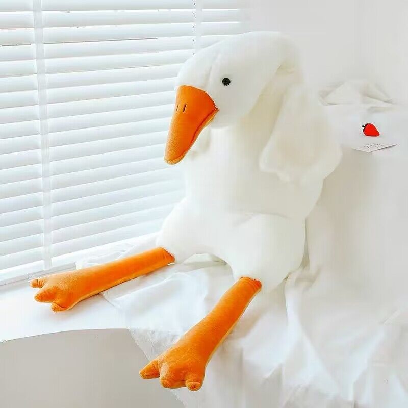 Coussin en peluche de gros oies blanches mignonnes