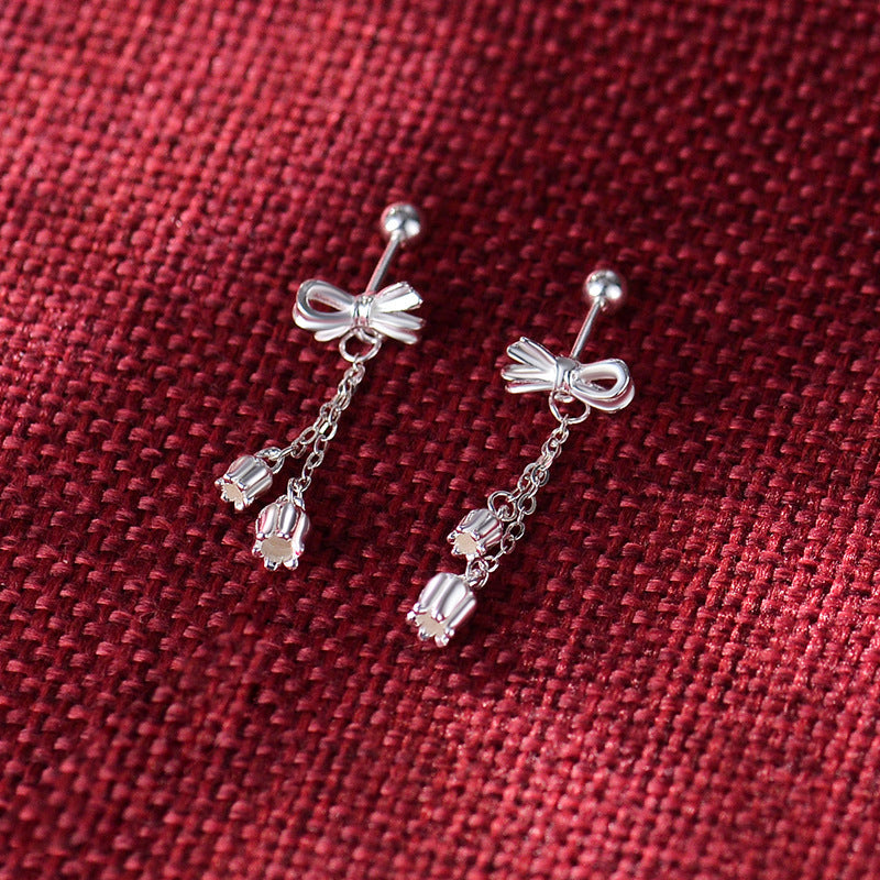 Boucles d'oreilles en forme de nœud avec pompon doux, clous d'oreilles en os, tempérament, minorités ethniques