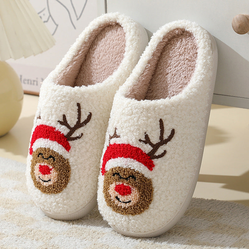 Chaussons de Noël en coton avec un mignon Père Noël en cartoon pour femmes et hommes, chaussures d'hiver chaudes et duveteuses pour couples.