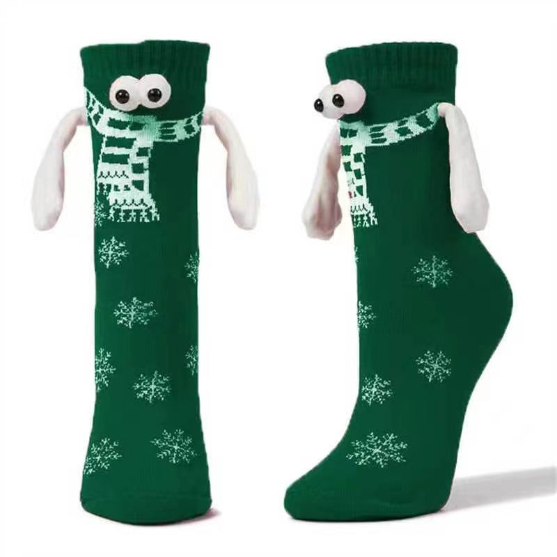 Couple de poignées magnétiques mignonnes avec des chaussettes de Noël.