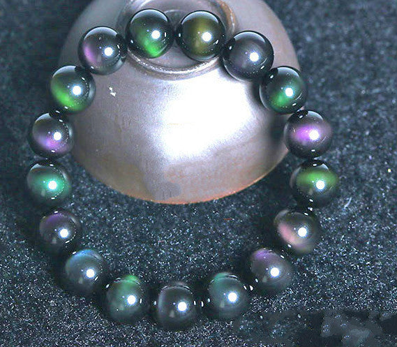 Bracelet en obsidienne à œil violet et vert arc-en-ciel.