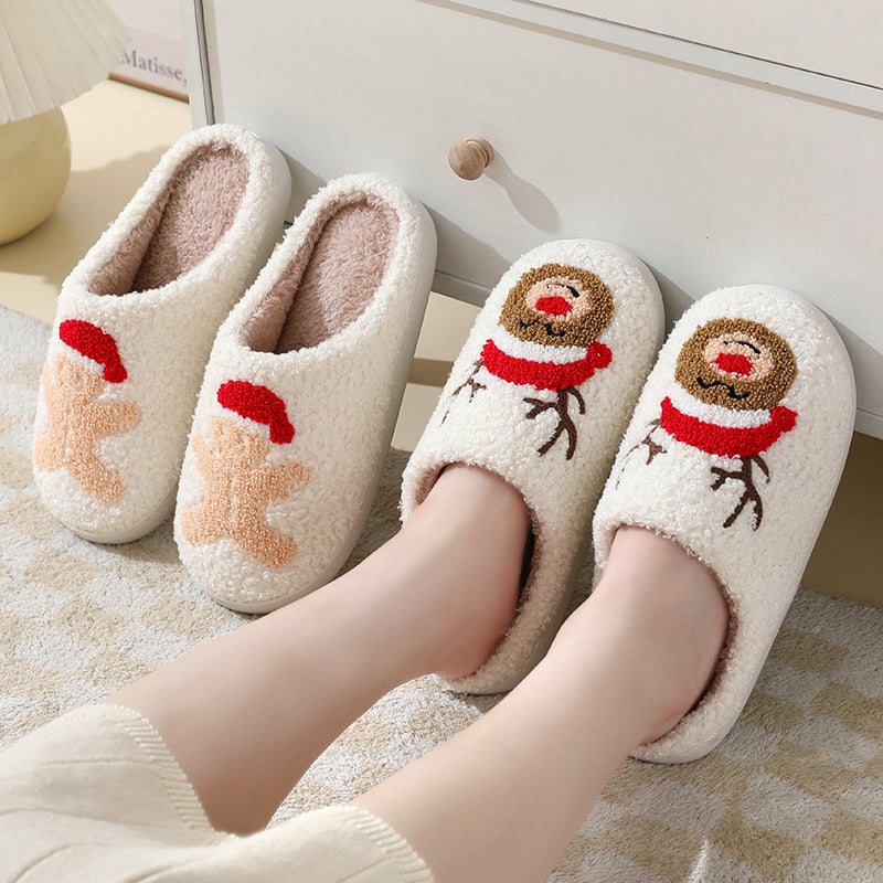 Chaussons de Noël en coton avec un mignon Père Noël en cartoon pour femmes et hommes, chaussures d'hiver chaudes et duveteuses pour couples.