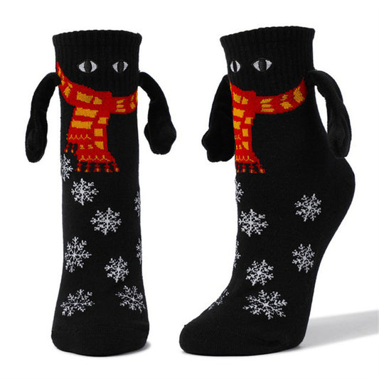 Couple de poignées magnétiques mignonnes avec des chaussettes de Noël.