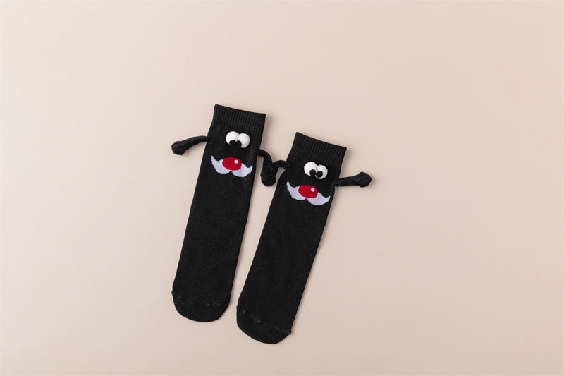 Couple de poignées magnétiques mignonnes avec des chaussettes de Noël.