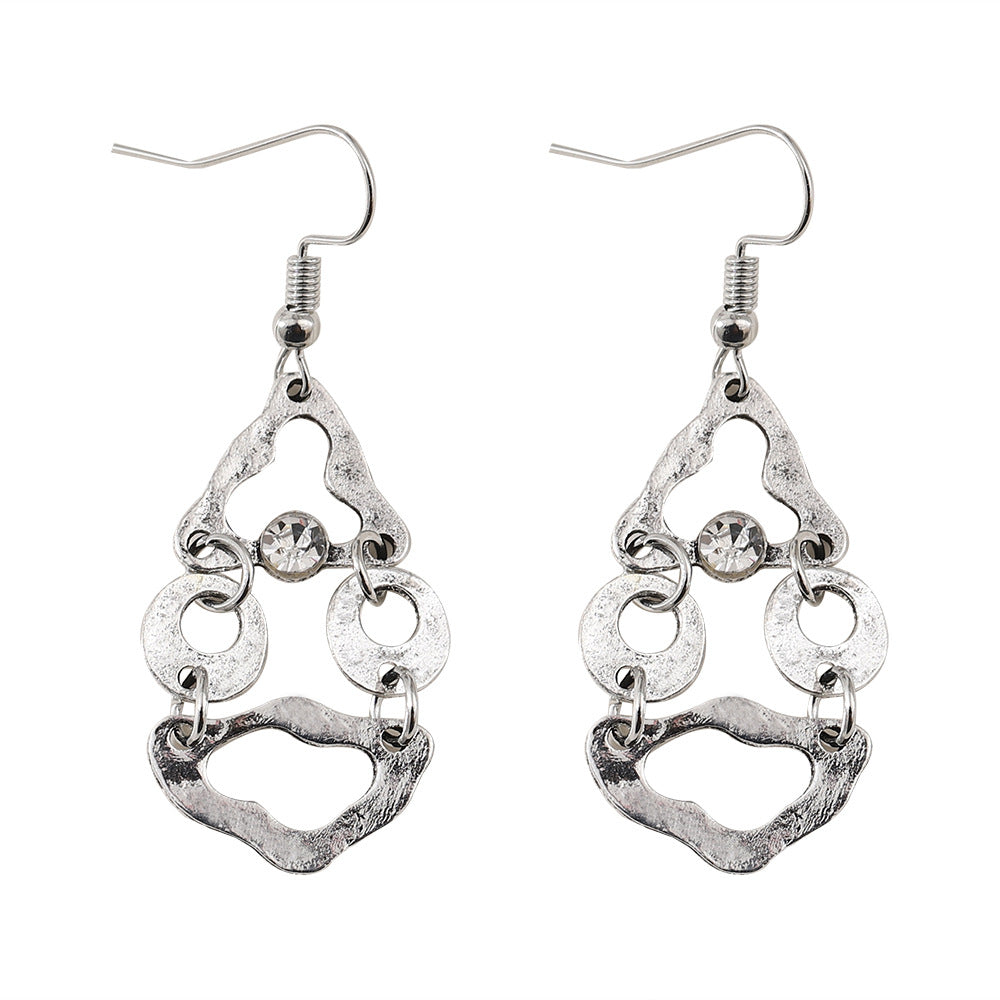 Boucles d'oreilles artistiques rétro géométriques à couture irrégulière et ajourées.