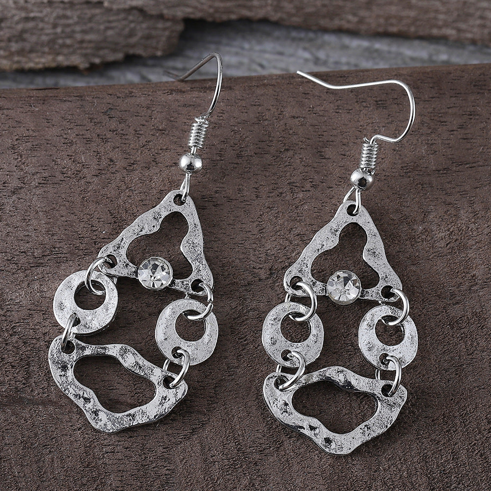 Boucles d'oreilles artistiques rétro géométriques à couture irrégulière et ajourées.