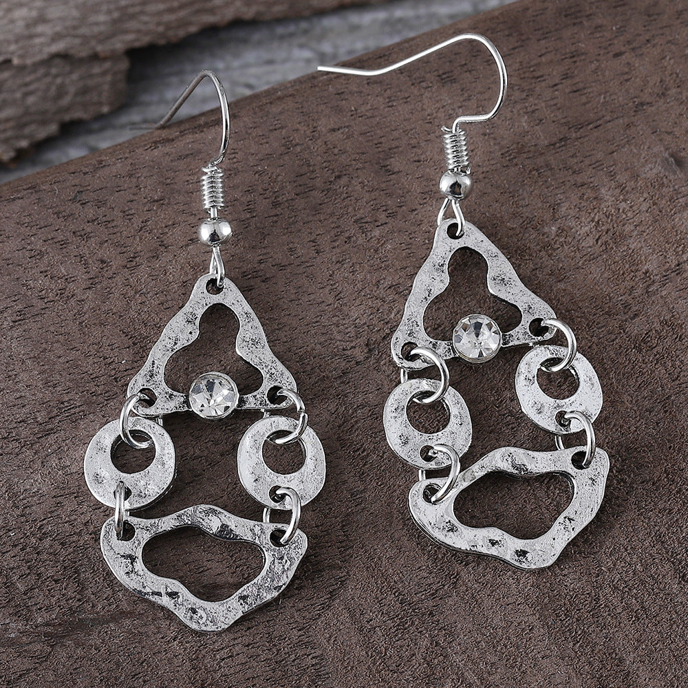 Boucles d'oreilles artistiques rétro géométriques à couture irrégulière et ajourées.