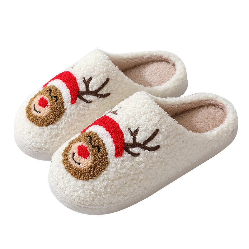 Chaussons de Noël en coton avec un mignon Père Noël en cartoon pour femmes et hommes, chaussures d'hiver chaudes et duveteuses pour couples.